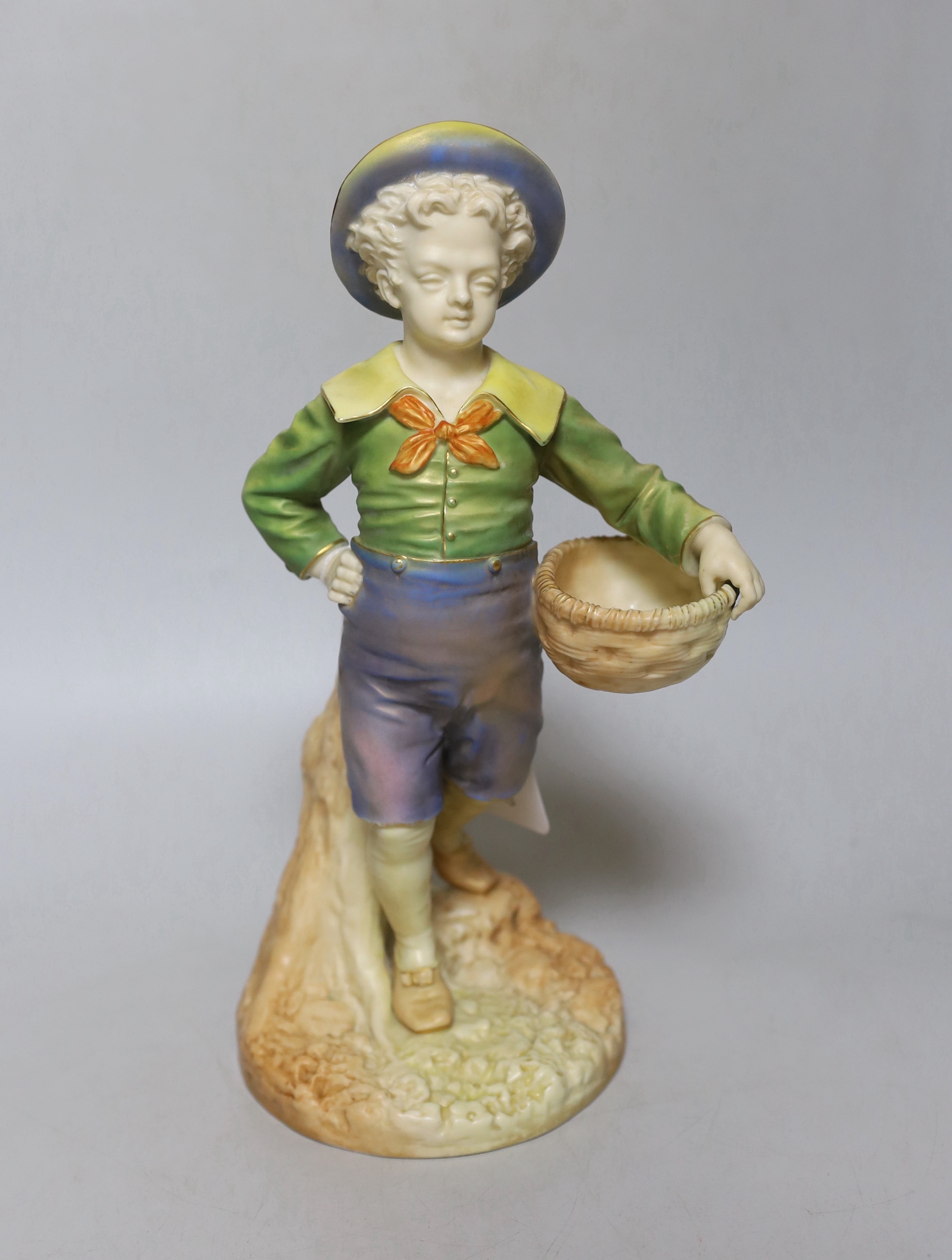 A Royal Worcester figure of a boy with a basket and a broad brimmed hat painted in shot enamels shape 1388, date mark 1895, 28cm high